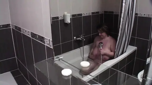 Mature brunet slowly pleasure in the bathroom