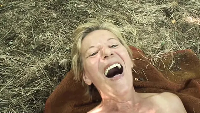 Older woman enjoys outdoor doggystyle