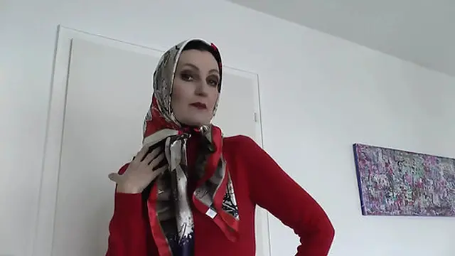 Lady Victoria Valente Showed Elegant Satin Headscarves with a Red Cashmere Turtleneck Sweater