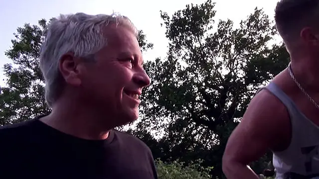 Unknown milf strolls by two men with big dicks and pleases both