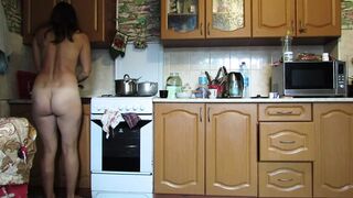 Naked hostess in the kitchen