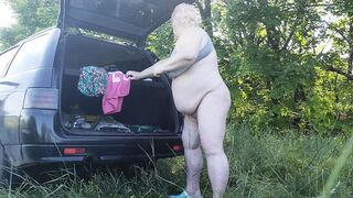 Mother-in-law masturbates her pussy in nature