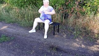 a neighbor in the park undresses and masturbates to orgasm on a bench
