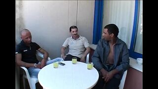 Two Young Sluts Surrounded by a Group of Mature Men