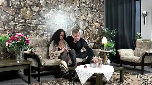 Sexy curly Milf sucks and fucks on huge cock on the couch